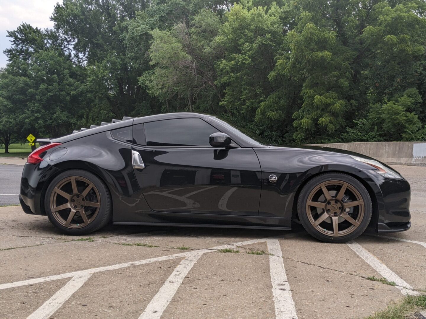 A black sports car parked in the parking lot.